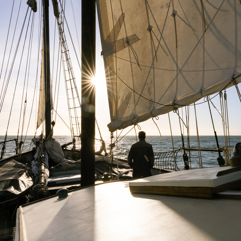 Grayhound_sailingship_HannahKeil-0306 A person standing next to the main mast of traditional sailing ship Grayhound
